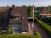 Ansicht mit Wintergarten und Zufahrt